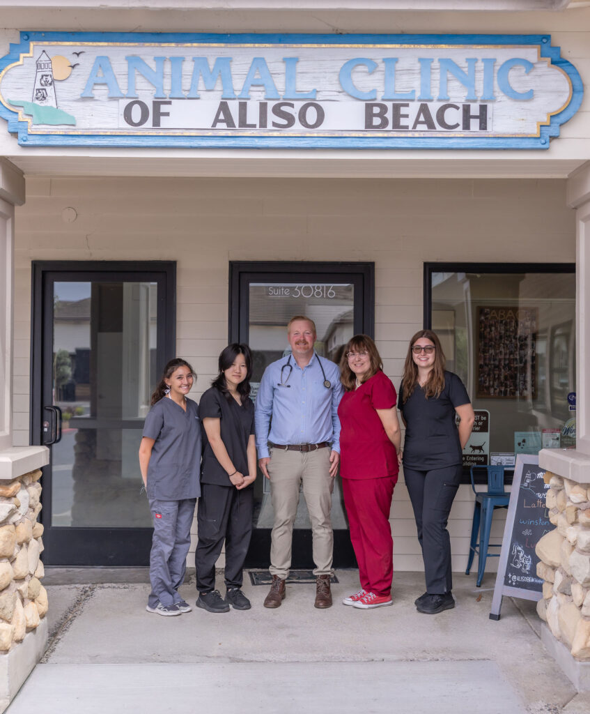 Dr. Bryan Hayter and the Aliso Beach Animal Clinic team outside the Laguna Beach veterinary clinic